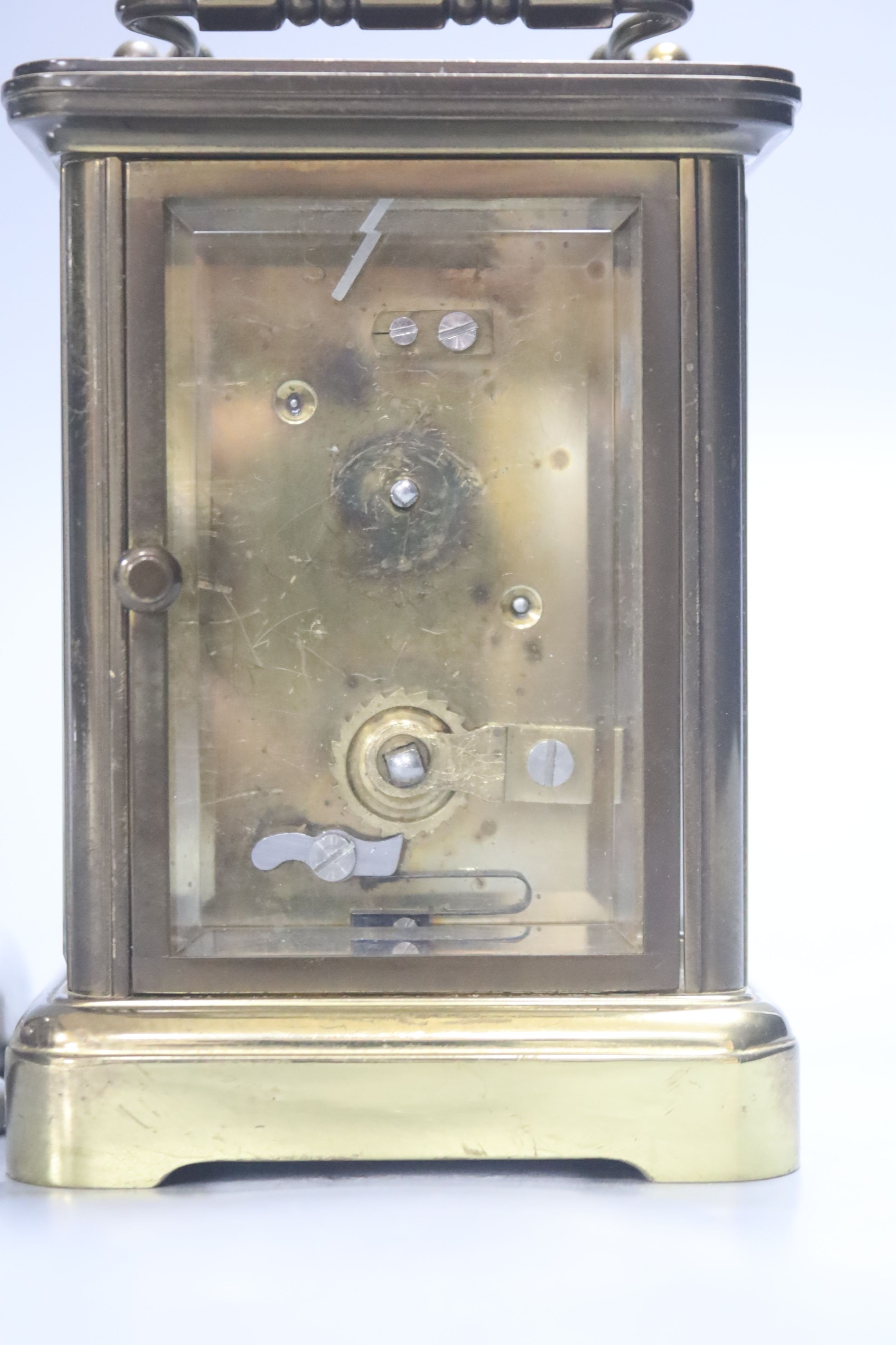 A French Obis cased brass carriage timepiece and a Liberty's Tudric pewter mantel timepiece, dial signed Newport, 21cm wide